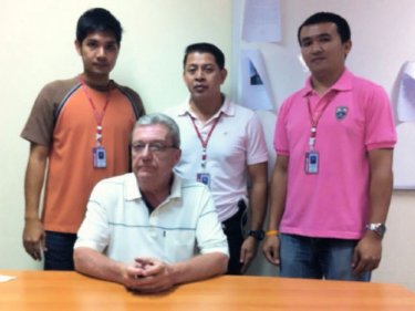 James Nelson with officers from Phuket Immigration last night