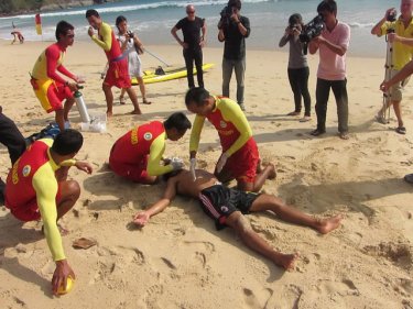 Lifeguards train on Nai Harn beach, near what could be a safety centre