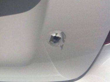 The bullet hole in the rear of the Phuket vehicle