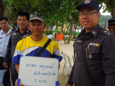 Marine Police question a jet-ski operator on Patong beach today