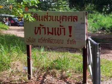 A sign warns people to keep out on a track used by Phuket  villagers