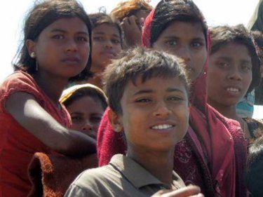 Young women and children, spotted on a Rohingya boat on January 1, 2013