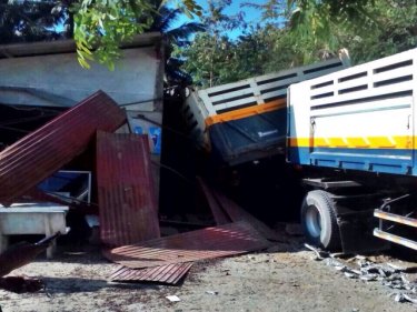 The truck comes to rest after partly demolishing a Phuket home