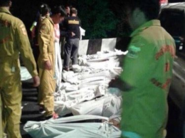 Bus bodies lain out after the horrendous crash in northern Thailand