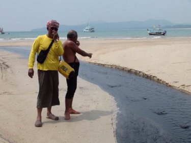 Residents react to the stink at Phuket's Bang Tao canal yesterday