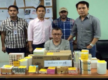 Police with Rawitwong Kitiacharapong, arrested over drug sales