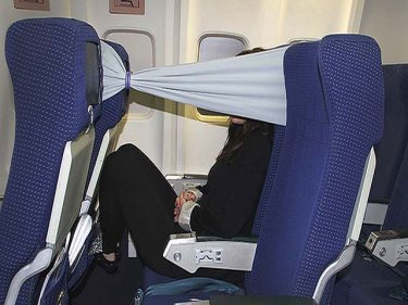 Privacy on a plane, or so the passenger imagines, with this idea