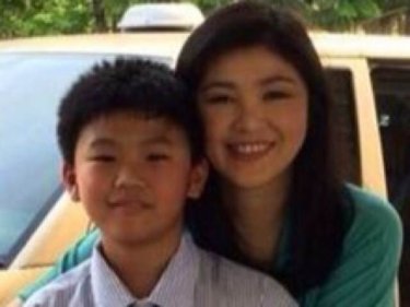 Former Thai PM Yingluck Shinawatra with her son, Supasek