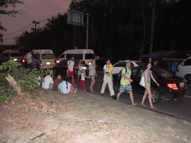 Travellers forced to walk during a long blockade on Phuket's main road