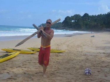 Surfers salvage dangerous pieces of wood from Surin beach today