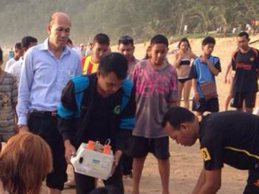 Mayor Aroon Solos looks on at lifesaving efforts on the beach yesterday