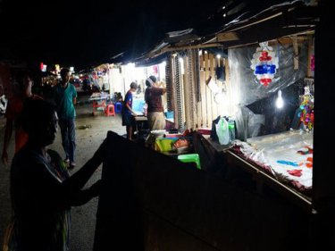 Stalls mark the Phuket foreshore where Rawai's sea gypsies live