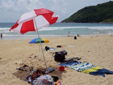 Nai Harn beach, where swimmers bring their own umbrellas