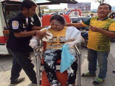 Pichaya Seakin, 11, being admitted to hospital with father Paiboon (right)