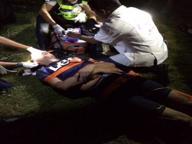 ''Nikolai'' being treated by rescuers at the base of the Phuket cliff last night