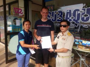 Santi Pawai serves closure notice papers on Sub Aqua on Phuket today