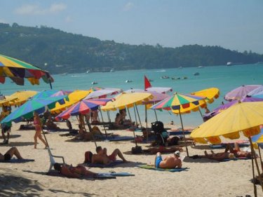 The brollies are back but without sunbeds at Phuket's Patong beach today