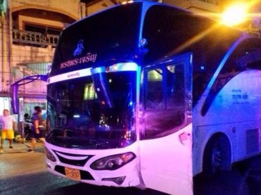 The bus comes to rest after crashing down Phuket's Patong Hill tonight