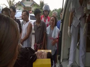 One of the injured is loaded into an ambulance after the bus crash today