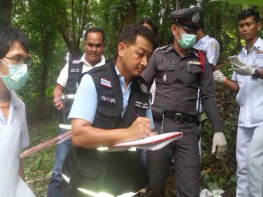 Police and paramedics at the scene of the skeleton find above Patong