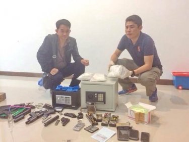 Police with the drugs and weapons haul at the house in Phuket City last night