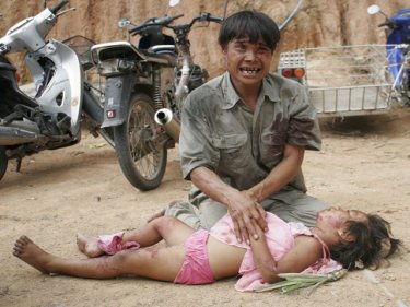 A father mourns his daughter, one of six killed in a Phuket crash in 2011