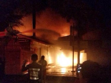 Firemen battle the blaze that ripped Kata Plaza on Phuket last night