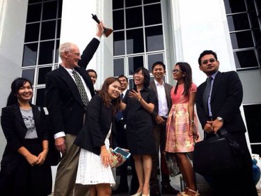 Alan Morison and Chutima Sidasathian with their lawyers at Phuket court