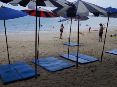It is illegal to put out umbrellas and mats without tourists on them