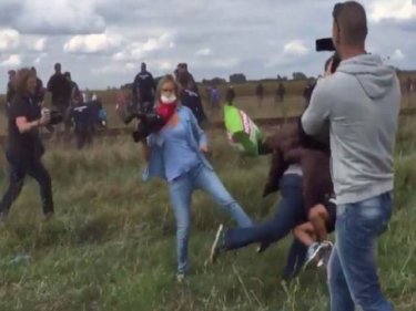 A right-wing camerawoman is sacked for tripping fleeing refugees