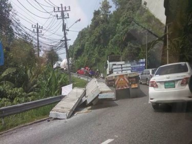 A semitrailer shed its load of concrete blocks on Patong Hill about 10am today