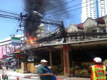 Smoke heads skyward from the Tarboosh blaze in Patong today