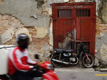 Popular graffiti appeals to many tourists in Penang, Malaysia