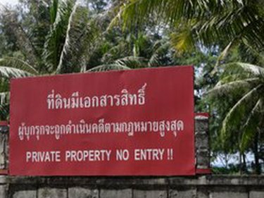 Signs like this cover the last few green spaces on Phuket's west coast