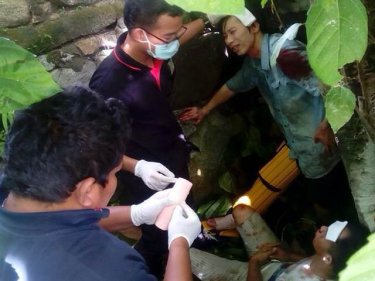 Injured Chinese tourists are patched up by rescuers after crashing