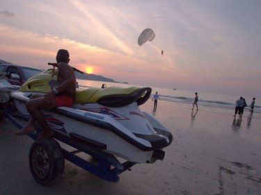''Natural'' sunset at Phuket's Patong beach, home to jet-skis and parasails