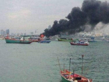 The disused ferry, awaiting motor repairs,  blazes at a pier in Pattaya today