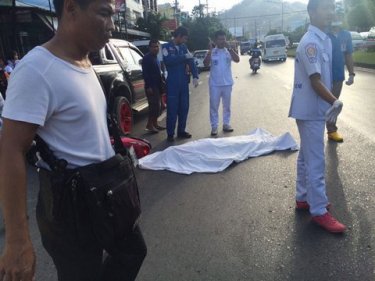 The body of the man on the roadway at the base of Phuket's Patong Hill