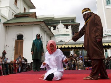 Student Nur Elita is caned for having affectionate contact in Aceh